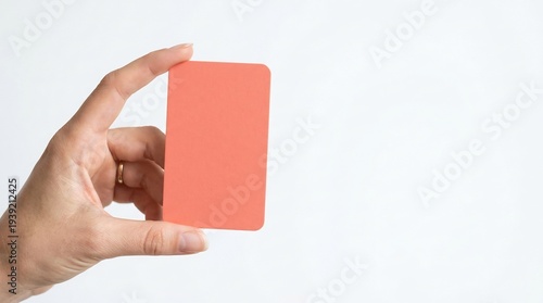 Wallpaper Mural Hand holding card shows vividly coral color Torontodigital.ca