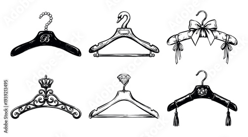 Six luxury vintage clothes hangers illustrated in a black and white sketch style, featuring ornate designs with a crown, diamond, swan, bow, monogram, and tassels