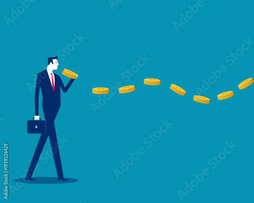 Greedy. Businessman eating string of gold coins  held in hand