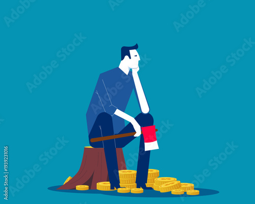 Bankruptcy. Businessman sitting despairingly holding an axe with gold coins
