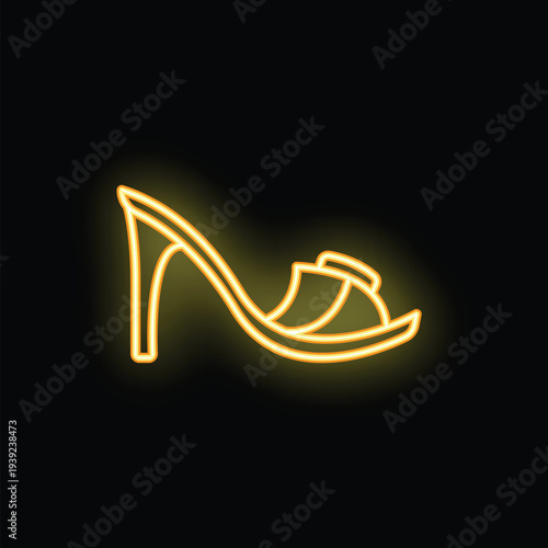 Yellow neon sign illustrating a high heel shoe, isolated on a black background