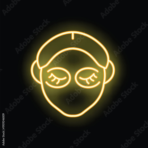 Bright yellow neon sign of a woman wearing cosmetic eye patches with her hair tied back with a headband