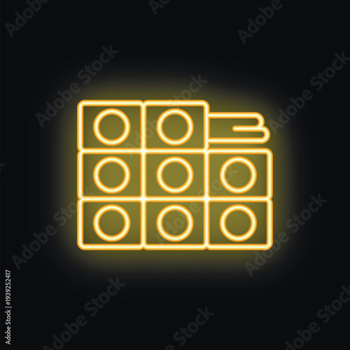 Yellow glowing neon sign of a professional makeup palette with eyeshadows or lipsticks