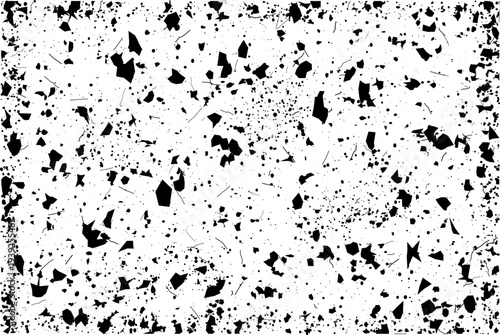 A chaotic pattern of black debris and fine particles covers a pristine white canvas