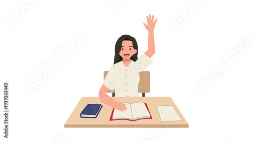 A student raising her hand while sitting at a desk with study materials.