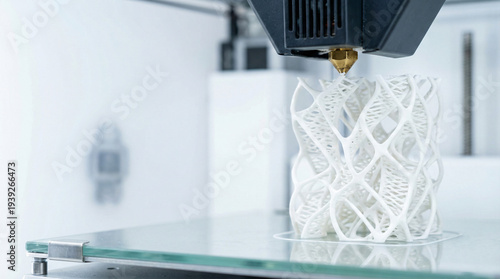 Modern 3D printing technology creating intricate white plastic sculpture in studio