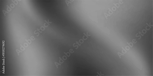 A polished silver plate features a brushed metal texture with a smooth stainless steel pattern and shiny metallic reflections on a gray aluminum surface backdrop