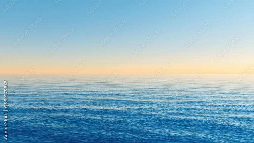 Fototapeta premium Smooth blue ocean surface under a calm clear sky at sunset