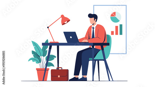 Professional man sitting at his office desk working on a laptop with a business chart and plant in the background.