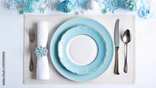 Winter holiday table setting with blue and white plates and silverware transparent background