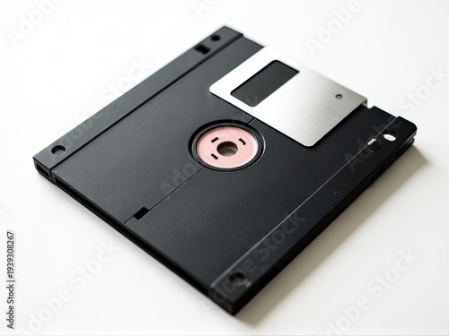 A floppy disk sitting on a clean white table, ready for use