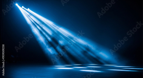 Bright Blue Spotlight Beams Illuminating Darkness.