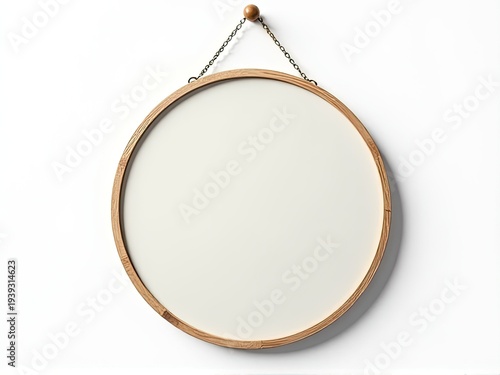 A close-up shot of a mirror hanging on a wall with a chain attached to it, suitable for use in interior design or home decor settings