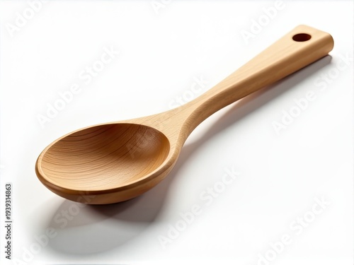 A single wooden spoon placed on a clean white surface