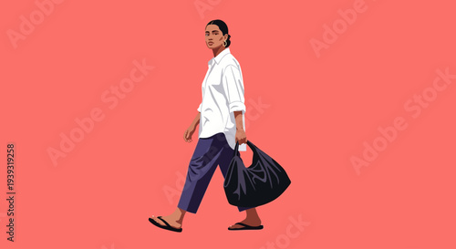 Man walks with bag in hand on urban street at night uiolkjh