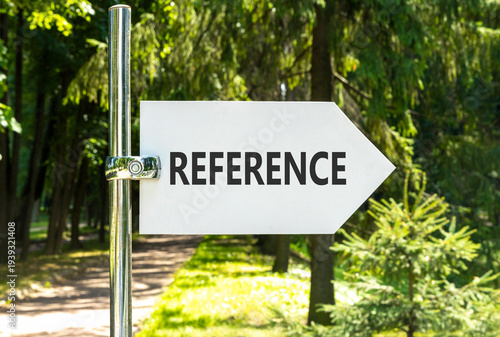 References or reference symbol. Concept word Reference on beautiful big white road sign. Beautiful green garden or forest background. Business references or reference concept. Copy space.