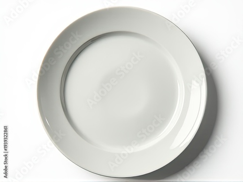 A simple white plate sits on a table, ready for use