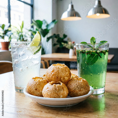 Homemade Freshly Baked Coconut Macaroons, A dish of crunchy fried balls and garlic on the side, Appetizing Fried Coxinhas Arranged on a Plate with Pickles and Sauce Delicious 
