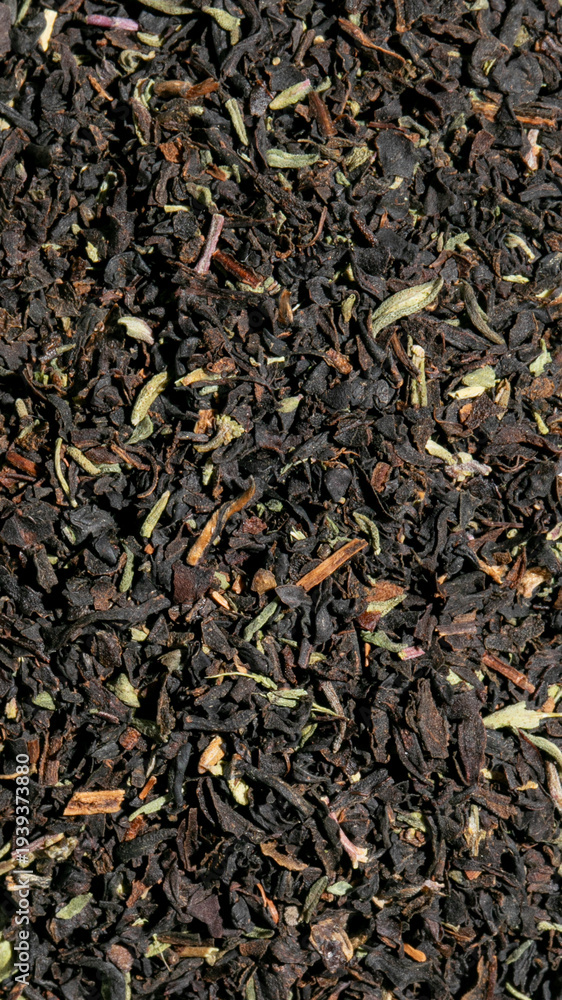 Fototapeta premium Aromatic black tea leaves dance in earthy harmony, invoking Samhain rituals and grounding Tibetan meditation ceremonies, richly textured
