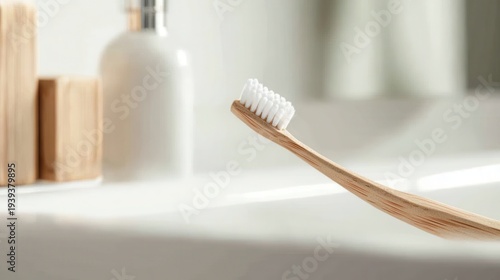 Close-up of a natural bamboo toothbrush with white bristles, a sustainable choice for daily oral hygiene and dental care routines.