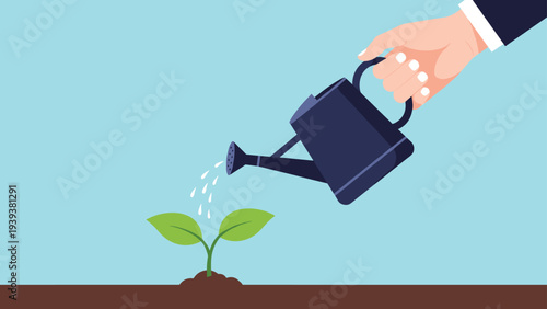 Professional hand holds a dark blue watering can pouring water onto a small green sprout growing from soil in a garden.