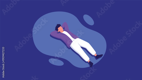 Young man lying down and relaxing with his hands behind his head on a blue background symbolizing rest and peace of mind.