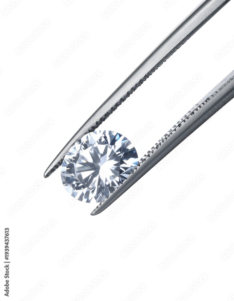 Fototapeta premium A sparkling, round-cut gemstone held delicately by silver tweezers against a bright white background, showcasing its brilliance