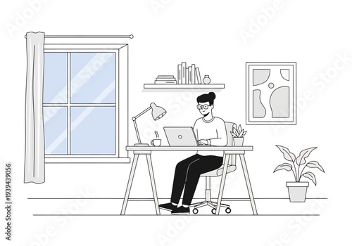 Person working on laptop at desk near window in home office with plants and artwork on wall