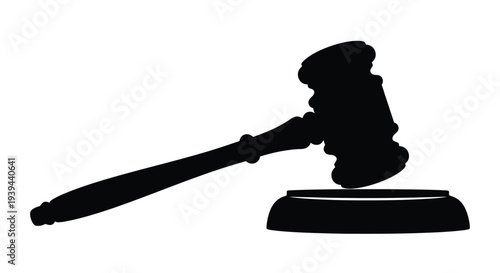 A black silhouette of a gavel resting on a sound block silhouette