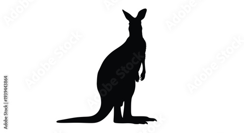 A striking black silhouette of a kangaroo in a natural pose
