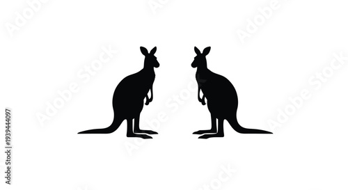 Two kangaroos facing each other a striking black silhouette
