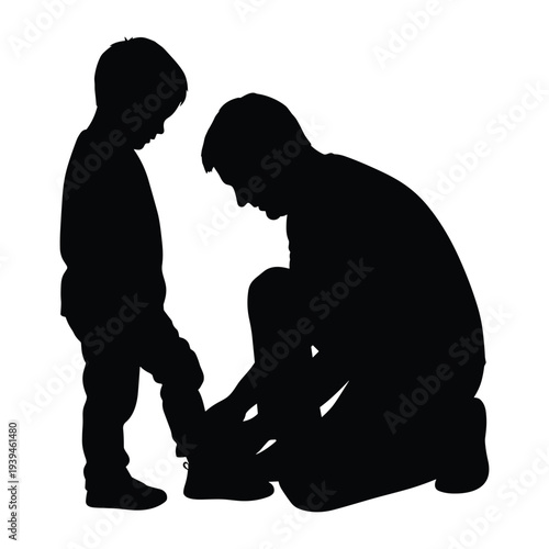 Father helping son tie shoelaces in heartwarming moment