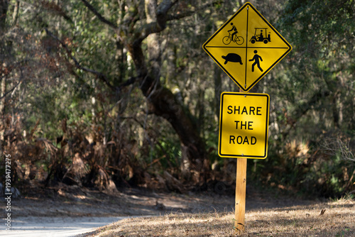 Canvas Print Sign Along Road in a Park Urging Drivers to Share the Road with other Vehicles a