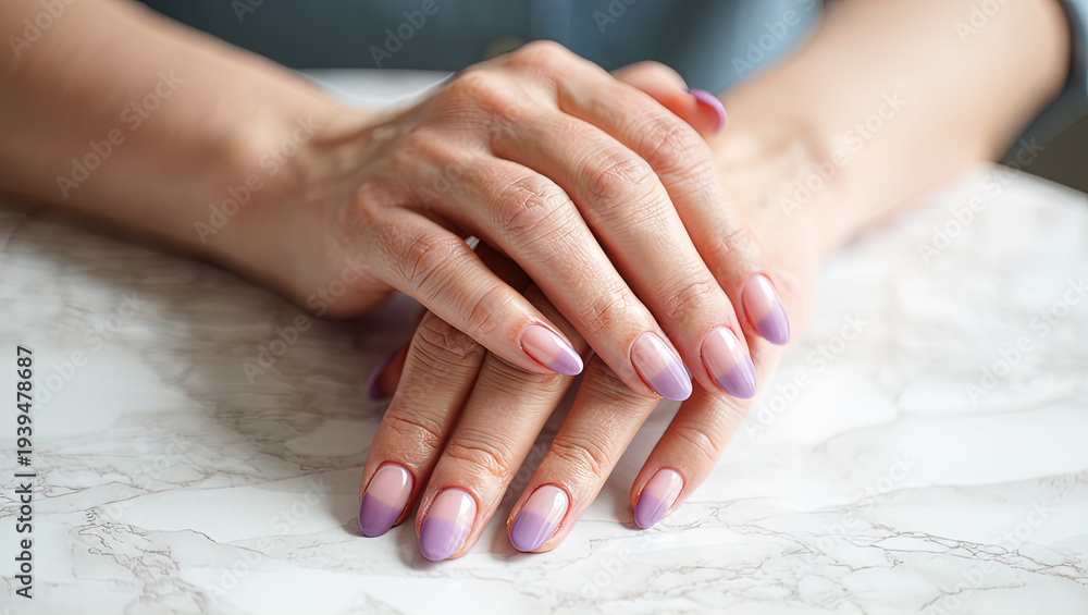 Naklejka premium The hands of a woman getting a manicure at a salon. Nail design. Nail salon.