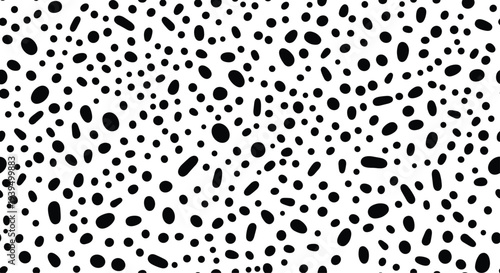 Seamless pattern featuring irregular black hand drawn dots and spots on a plain white background for textile design.