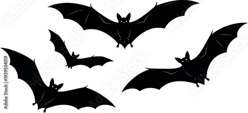 Black silhouette of flying bats on white background