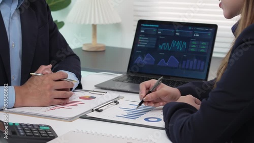 Business people analyzing financial data and charts during a strategy meeting in the office