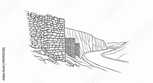 Ancient stone fortification overlooking a winding road through a rugged landscape