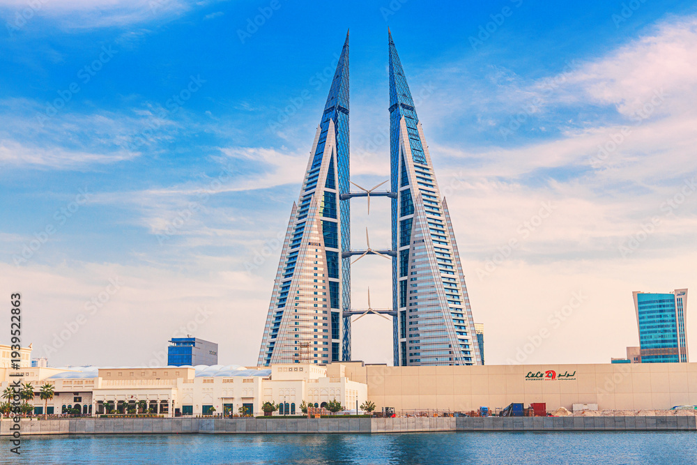 Obraz premium 2 December 2025, Bahrain, Manama: World Trade Center stands prominently in the city with innovative wind turbine integration