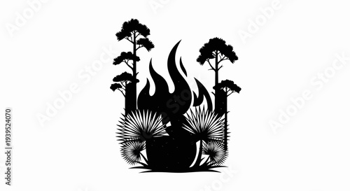 Silhouette of a forest fire with flames and palm-like foliage