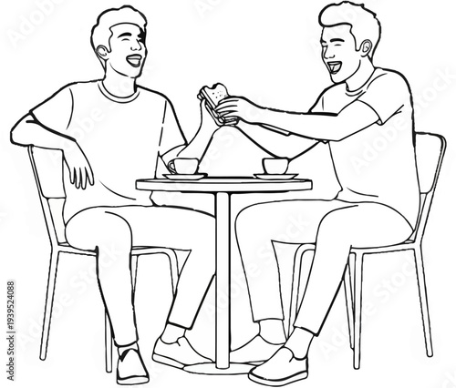 Two men sit at a table, laughing and sharing a sandwich over drinks