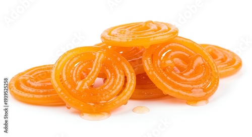 Group of Jalebis) Group of fresh juicy jalebis with sugar syrup drops traditional asian dessert.