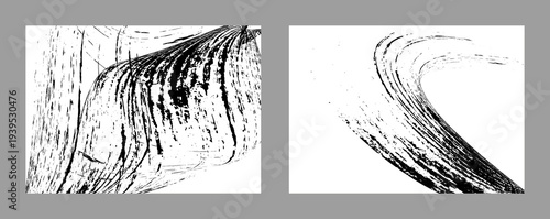 Black paint strokes on a white background