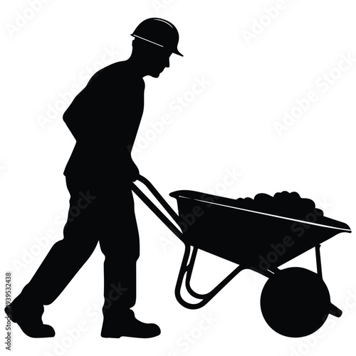Construction worker pushing loaded wheelbarrow