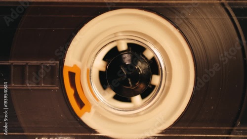 Retro radio tape recorder, audio cassette close-up. Listening to music, old radio boom box player, macro of vintage music listening. 
