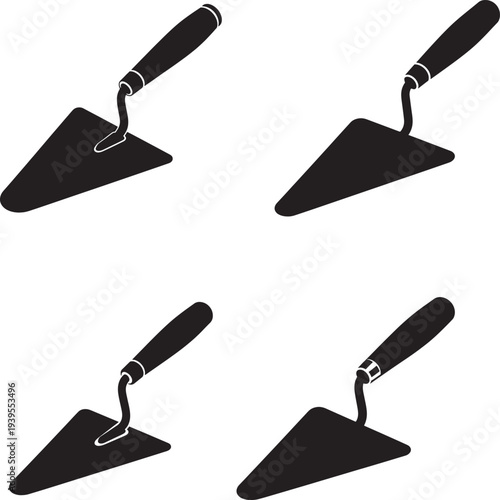 Four black trowels with triangular blades and handles
