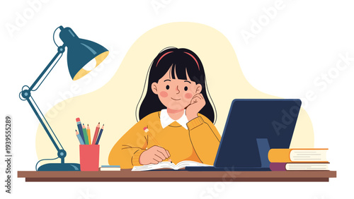Diligent young student sits at her desk at night and works on school assignments with the help of a laptop and desk lamp.