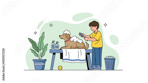 Young boy carefully grooming and brushing his pet dog on a table in a room decorated with indoor green plants.