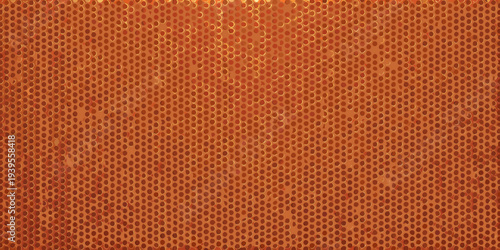 A textured orange surface featuring a dense pattern of small circular holes