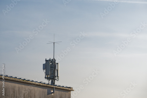 building rooftop packed with antenna and communications hardware units